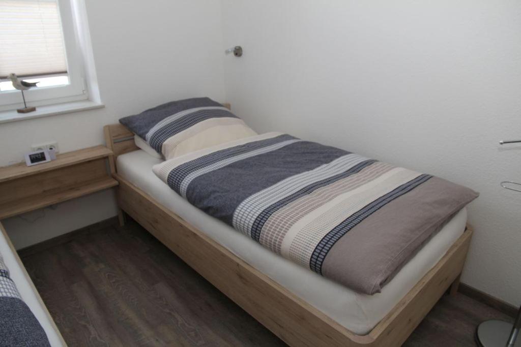 Postel nebo postele na pokoji v ubytování Friesenzauber