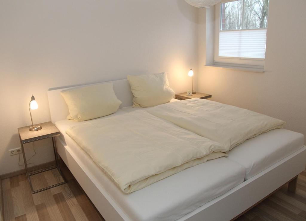 Postel nebo postele na pokoji v ubytování Fiete