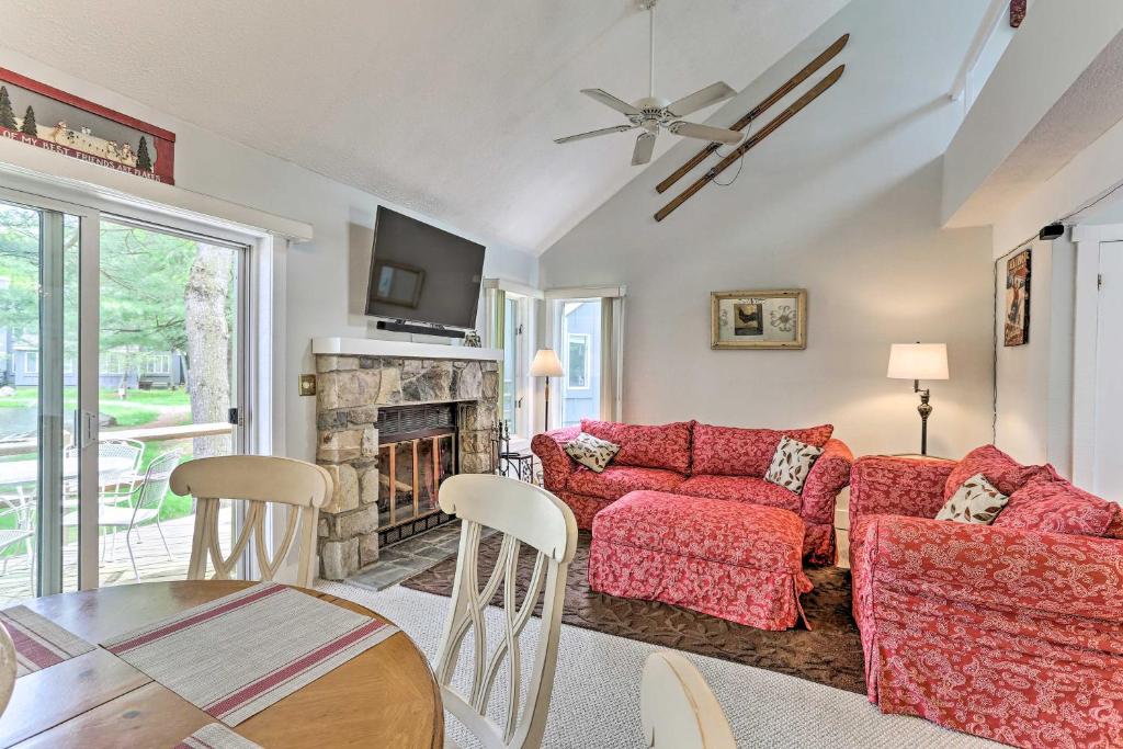 a living room with a couch and a fireplace at Less Than 1 Mi to Jack Frost Skiing! Home with Fishing Pond in Lake Harmony