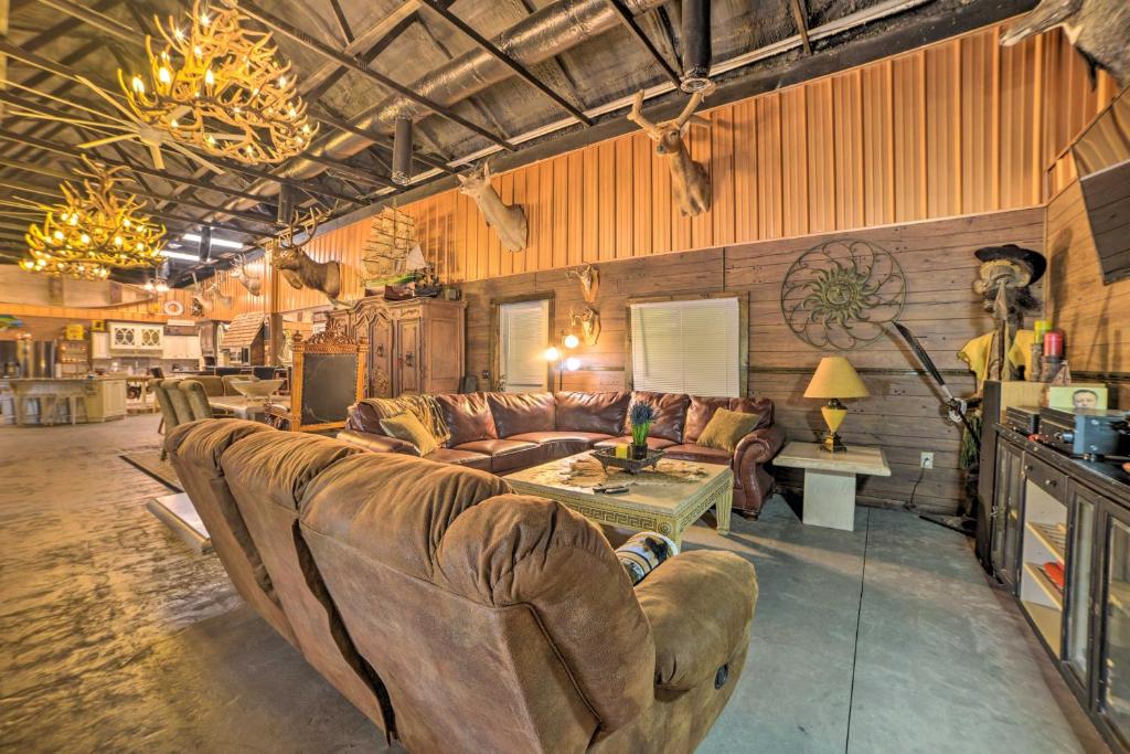 a large living room with a couch and a table at Family Leatherwood Resort Cabin with Fire Pit! in Dover