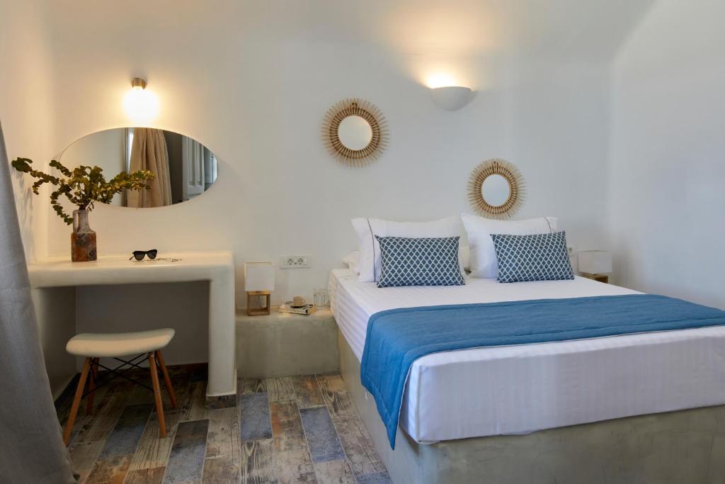 Postel nebo postele na pokoji v ubytování El Verano Suites