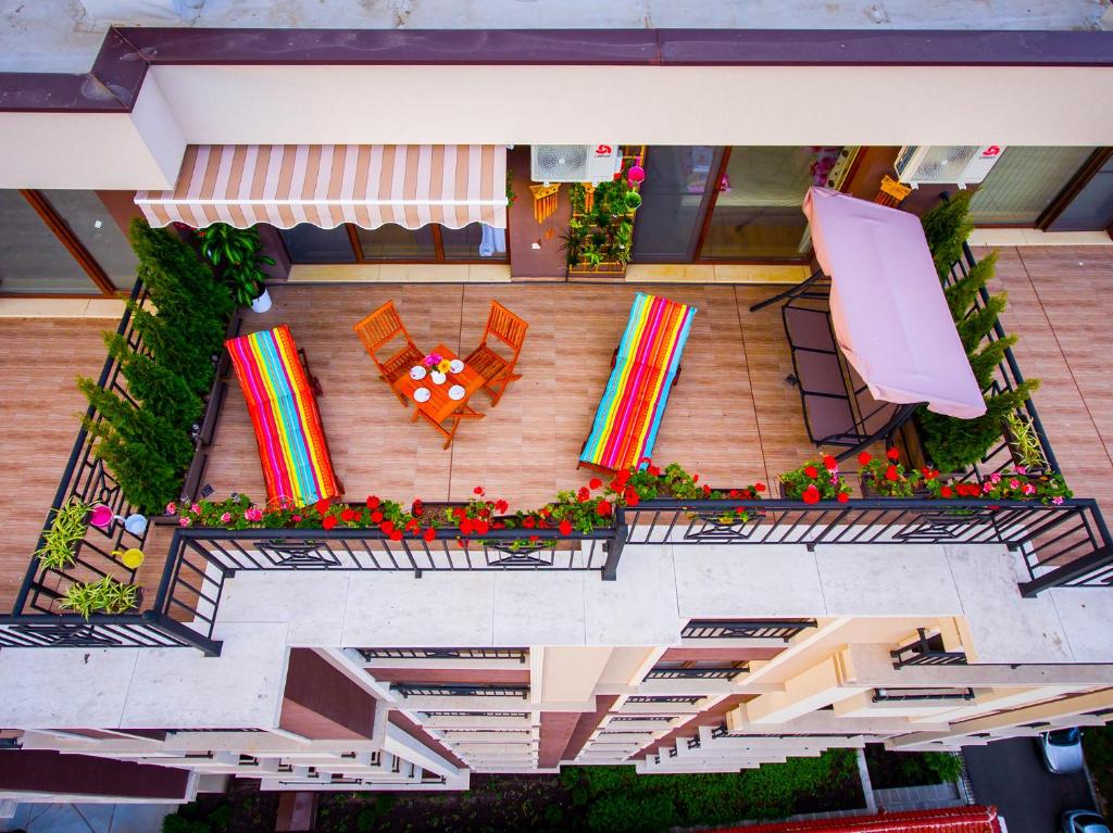 an overhead view of a patio with a table and chairs at Sky Garden Apartment Burgas in Burgas