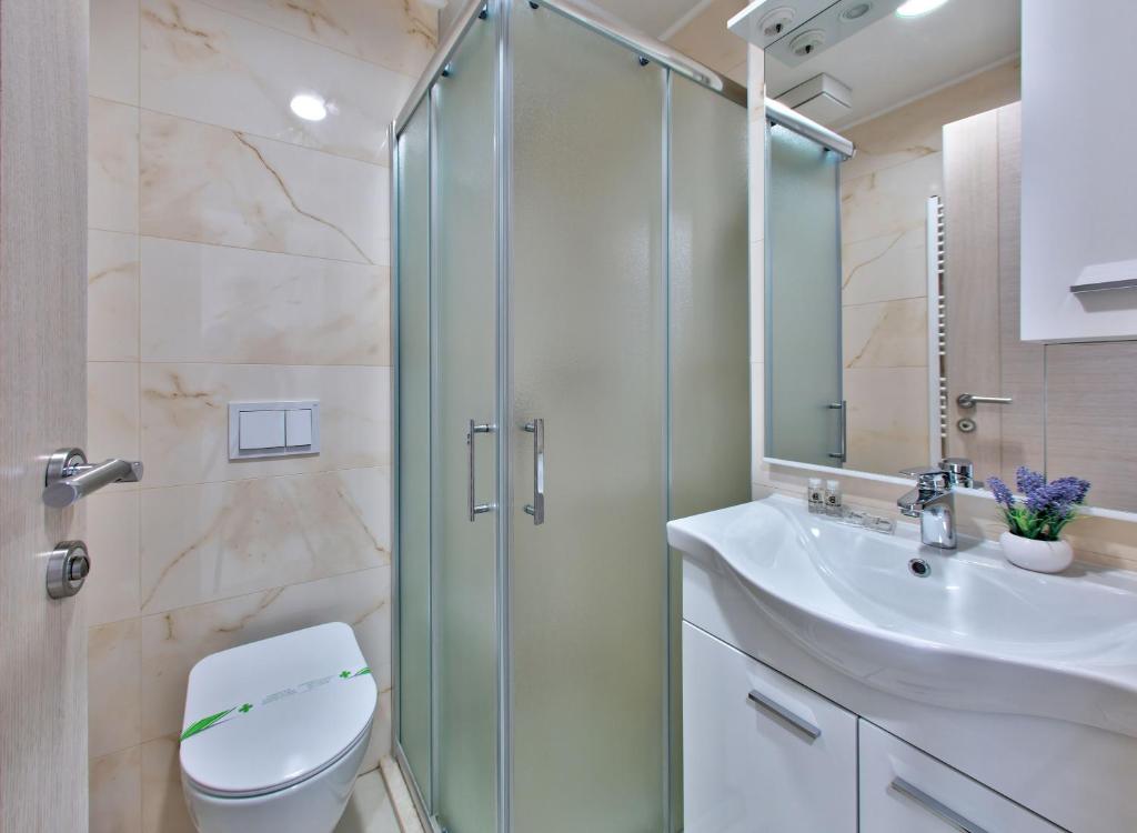 Koupelna v ubytování Hotel Dompes