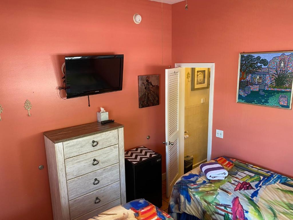 Postel nebo postele na pokoji v ubytování Caribbean House