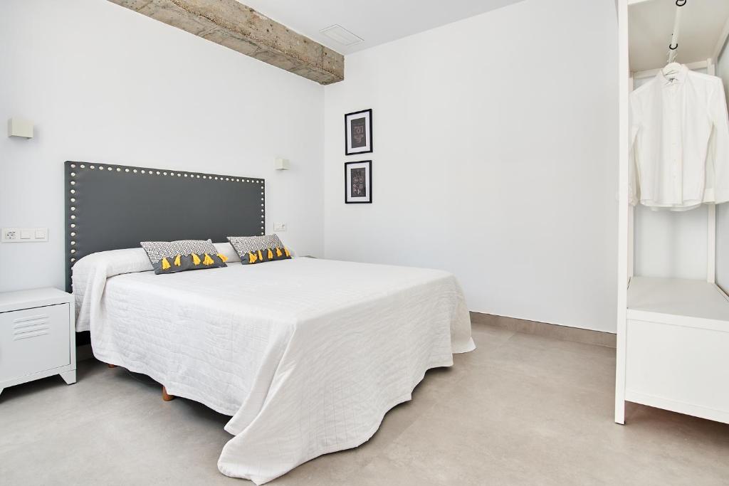 Posteľ alebo postele v izbe v ubytovaní 9 NIDOS Céntrica Suites - Nuevo
