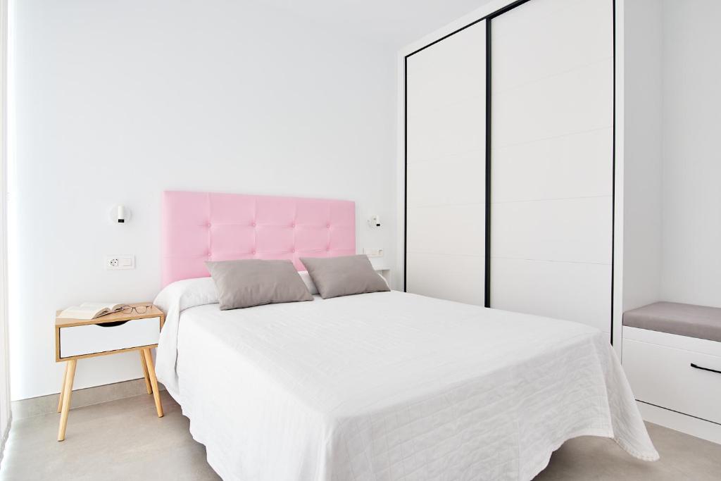 Posteľ alebo postele v izbe v ubytovaní 9 NIDOS Céntrica Suites - Nuevo