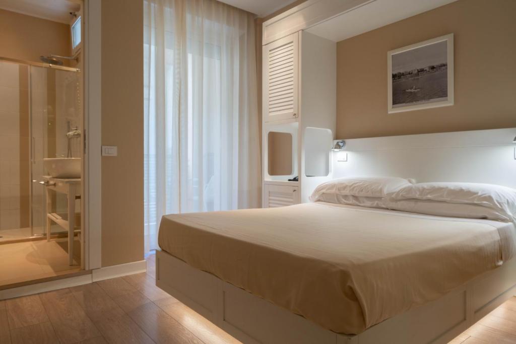 Postel nebo postele na pokoji v ubytování Hotel Bristol