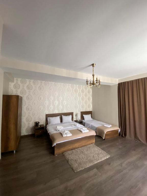 Postel nebo postele na pokoji v ubytování Borjomi Central