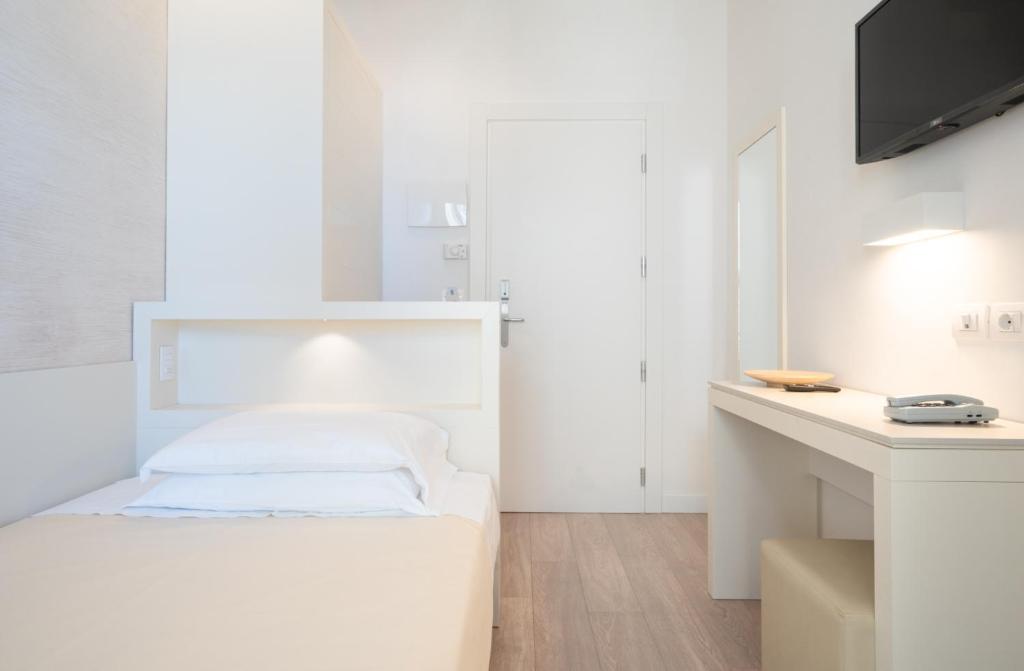 Postel nebo postele na pokoji v ubytování Hotel Bristol