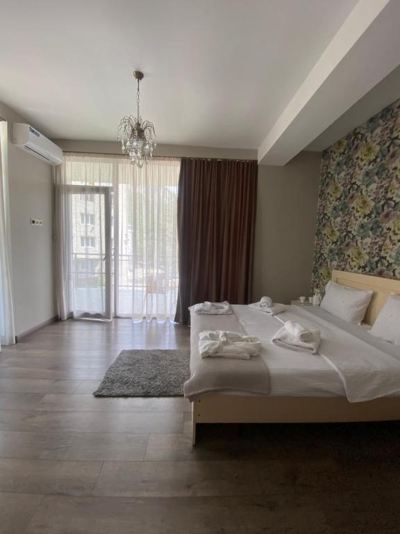 Postel nebo postele na pokoji v ubytování Borjomi Central