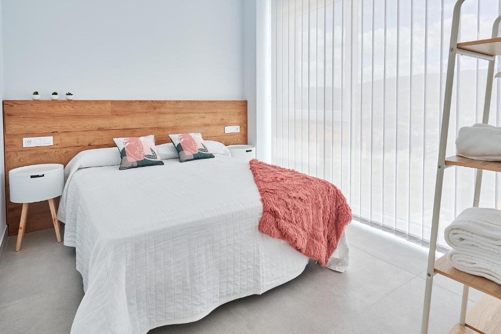 Posteľ alebo postele v izbe v ubytovaní 9 NIDOS Céntrica Suites - Nuevo