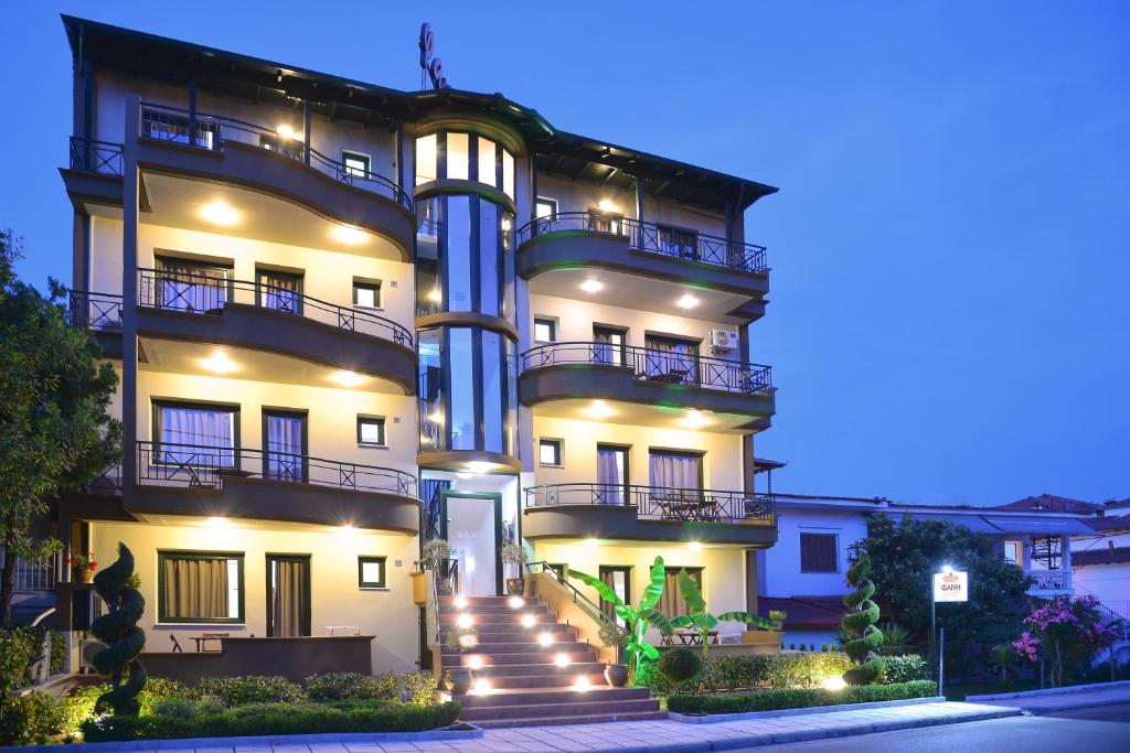 a large white building with stairs leading up to it at Hotel FanΙ in Leptokarya