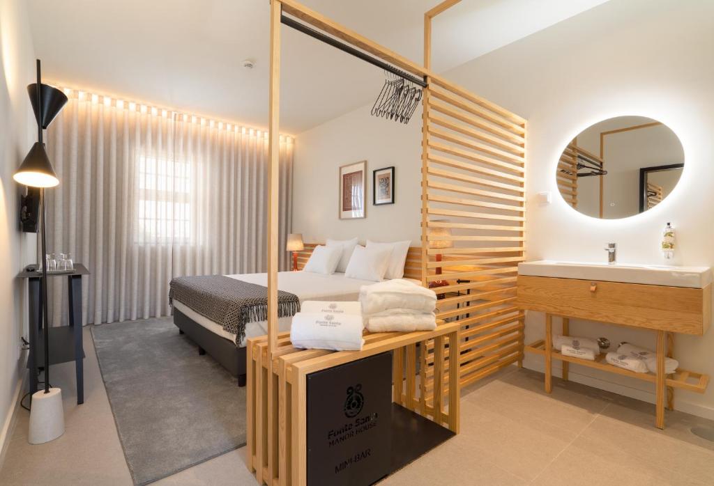 Ένα ή περισσότερα κρεβάτια σε δωμάτιο στο FONTE SANTA Manor House