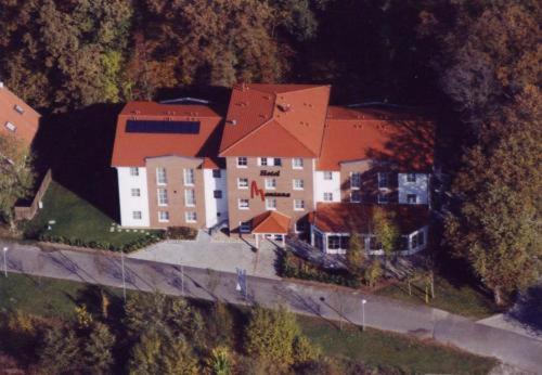 an aerial view of a large house on a hill at Montana Hotel Senden in Senden