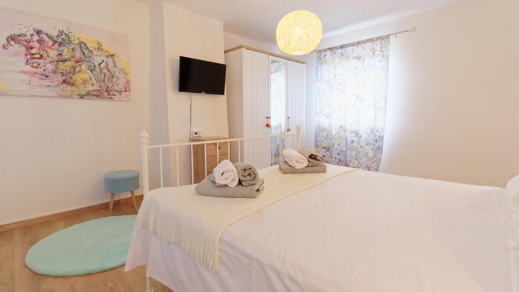 Łóżko lub łóżka w pokoju w obiekcie Villa Nicolara by Rent Istria