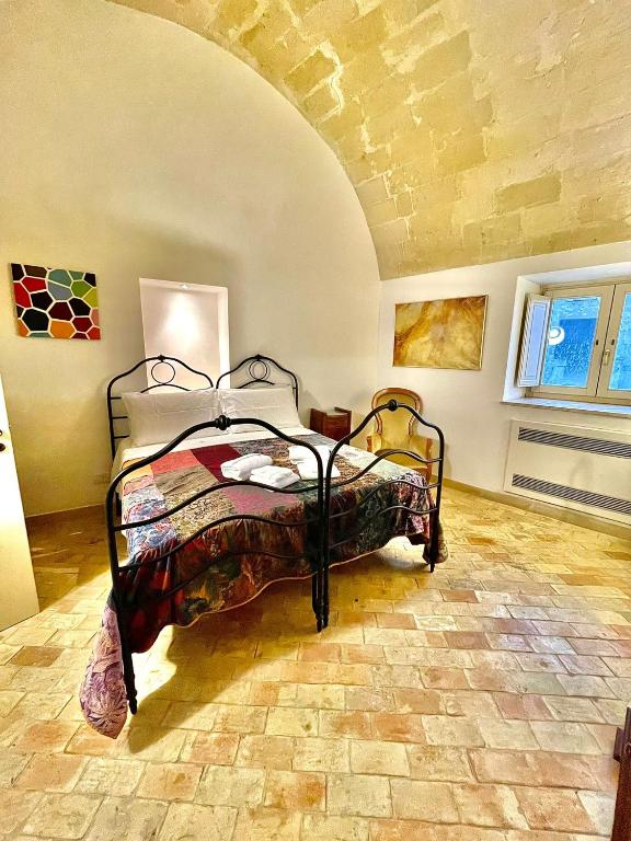 Postel nebo postele na pokoji v ubytování Dimora La Gravina
