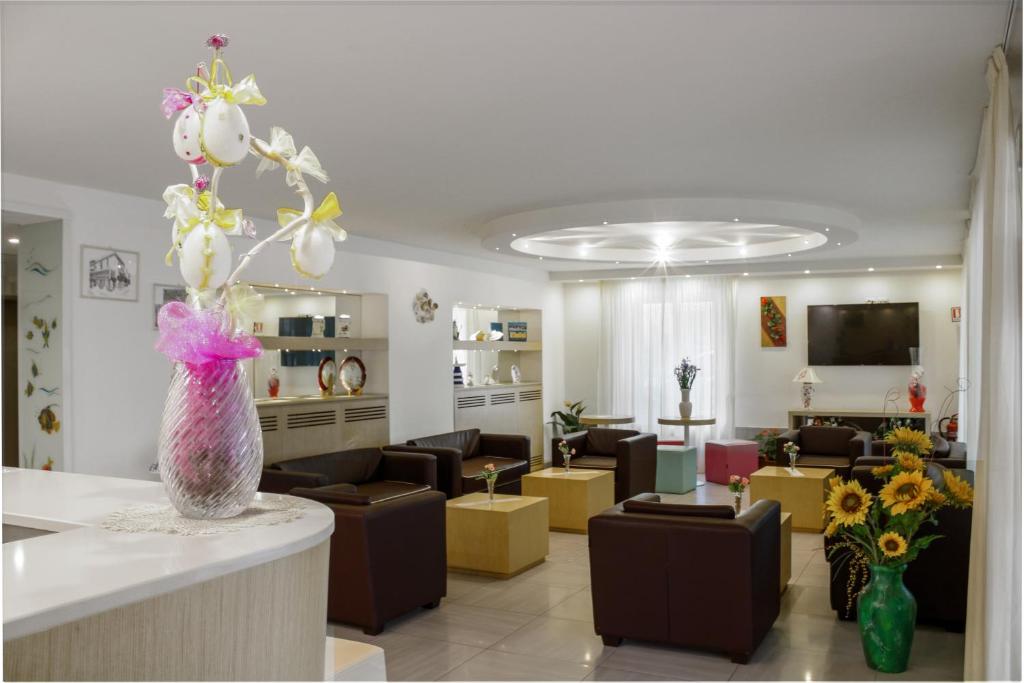 TV a/nebo společenská místnost v ubytování Hotel Ilde
