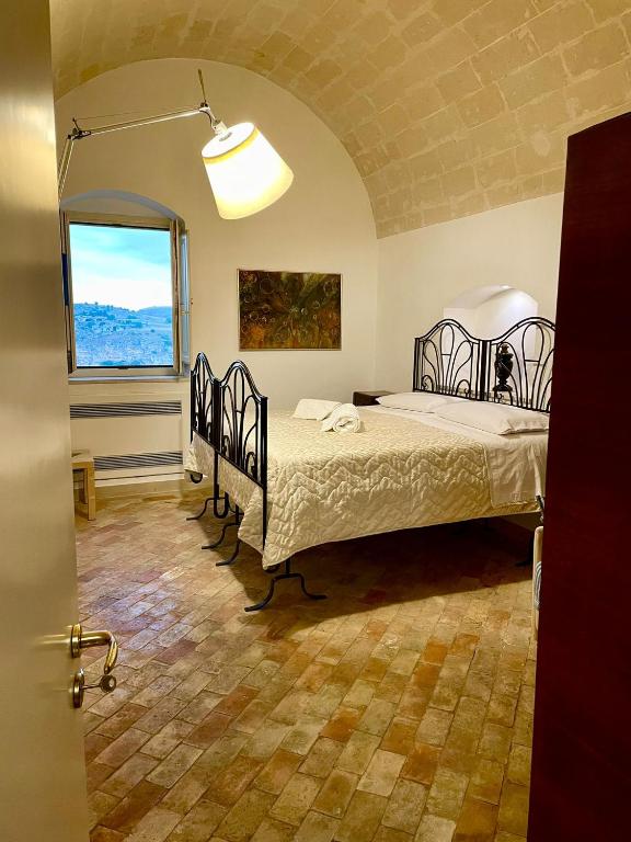 Postel nebo postele na pokoji v ubytování Dimora La Gravina
