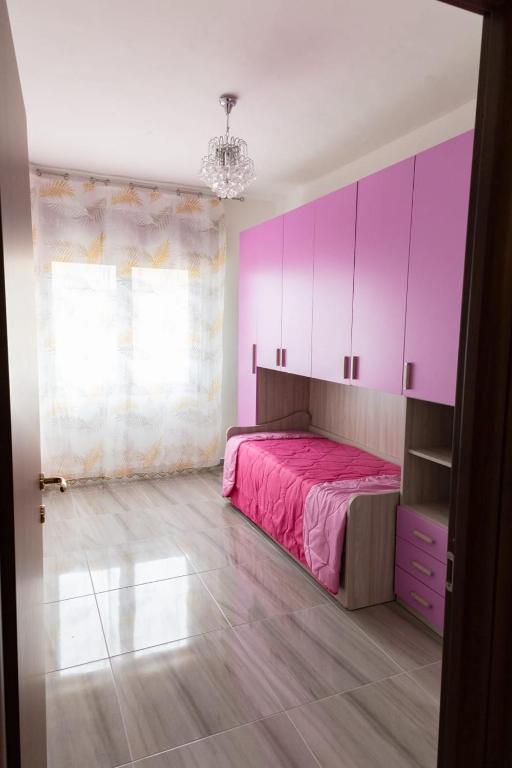 Posteľ alebo postele v izbe v ubytovaní L'APPARTAMENTO DEL MARE