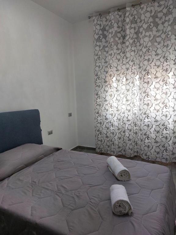 Posteľ alebo postele v izbe v ubytovaní L'APPARTAMENTO DEL MARE