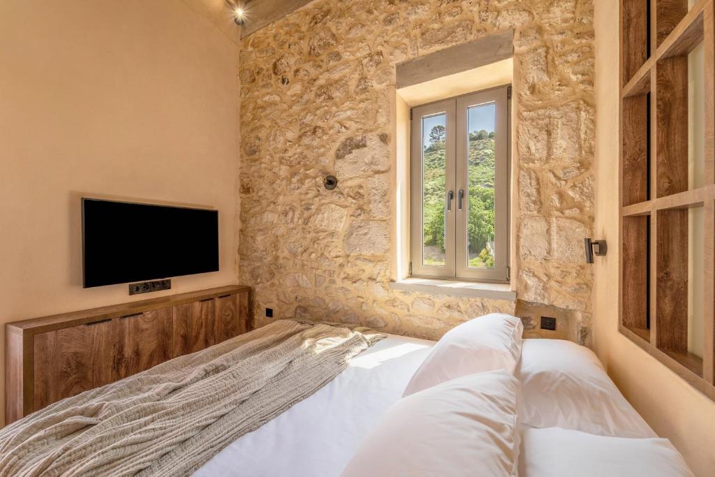 Posteľ alebo postele v izbe v ubytovaní Kaliva Residence