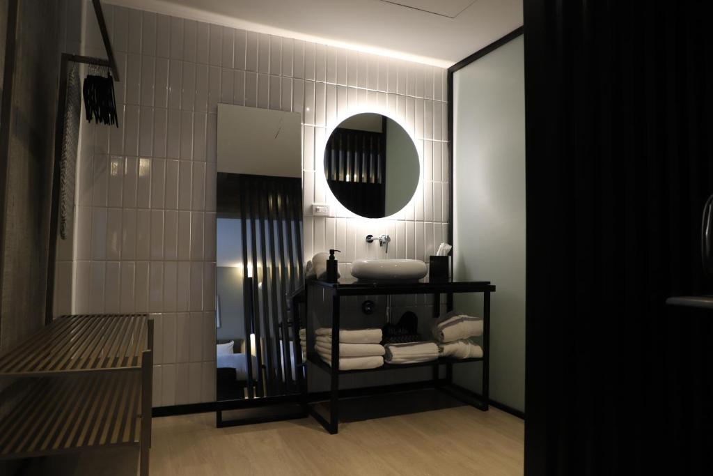 Postel nebo postele na pokoji v ubytování Bellwort Hotel