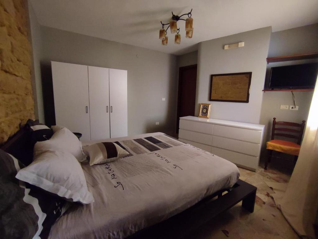 Ein Bett oder Betten in einem Zimmer der Unterkunft Le case di Grazia