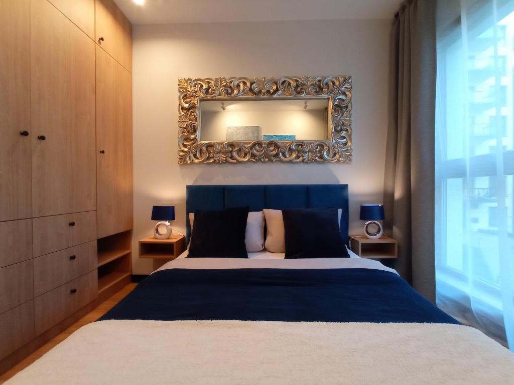 Posteľ alebo postele v izbe v ubytovaní Apartament Agat - AZW Gdańsk
