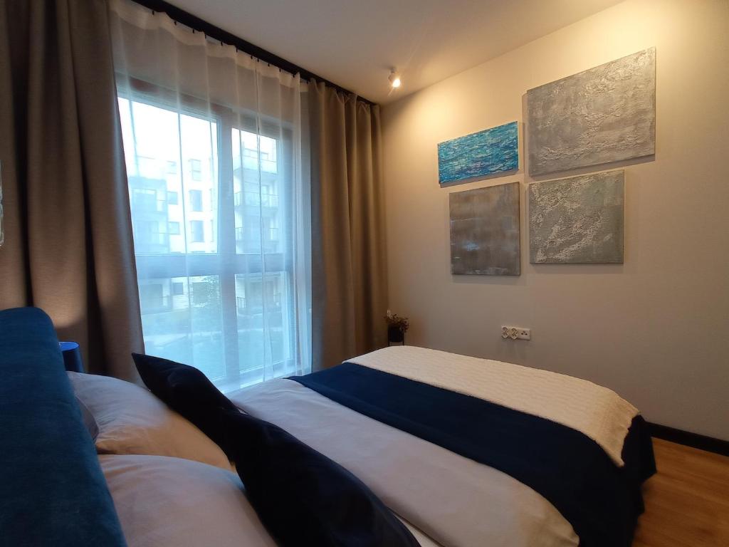 Posteľ alebo postele v izbe v ubytovaní Apartament Agat - AZW Gdańsk
