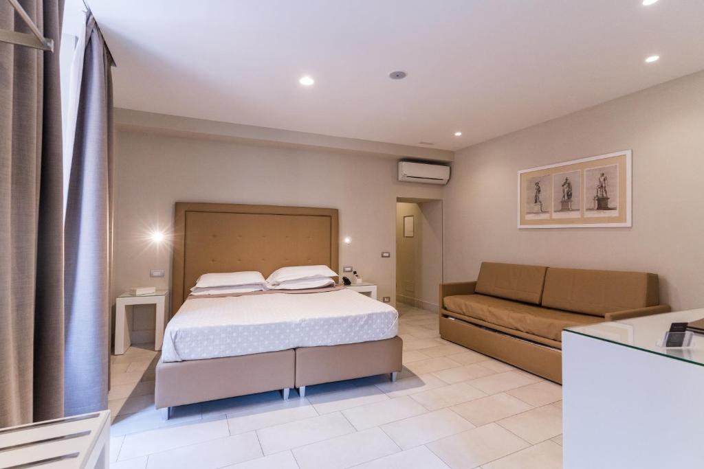 A bed or beds in a room at Magi House Relais