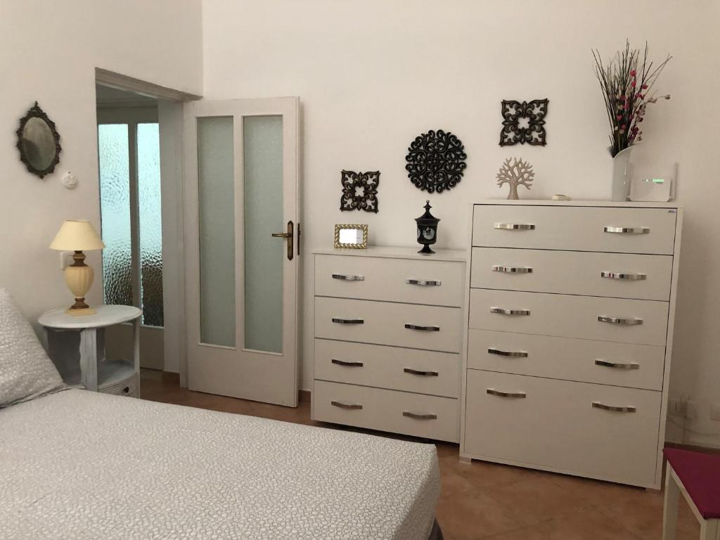 Łóżko lub łóżka w pokoju w obiekcie da Annamaré