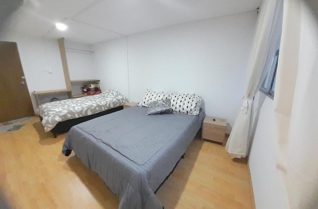 Postel nebo postele na pokoji v ubytování Casa Jaguar Manizales sector Cable