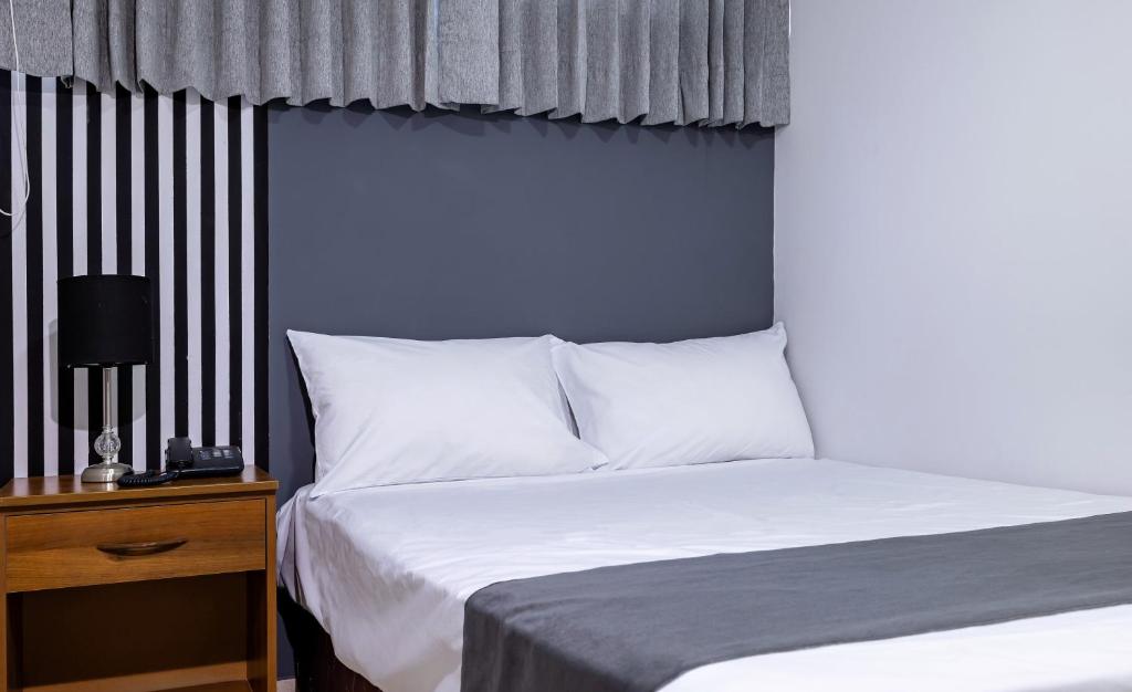 Postel nebo postele na pokoji v ubytování Hotel Taurus