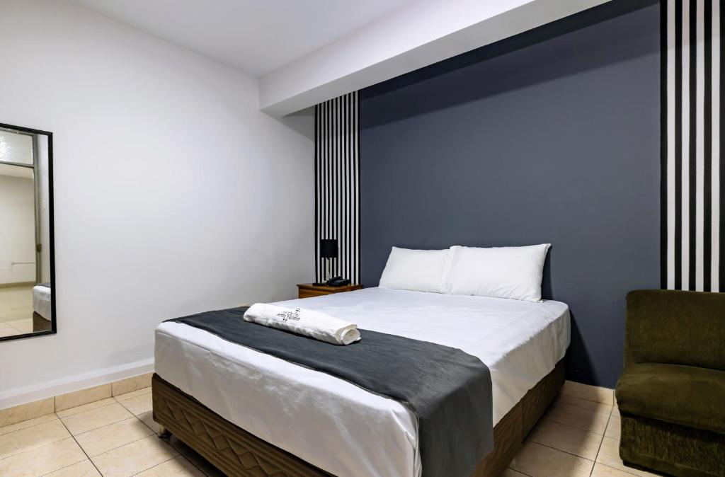 Postel nebo postele na pokoji v ubytování Hotel Taurus