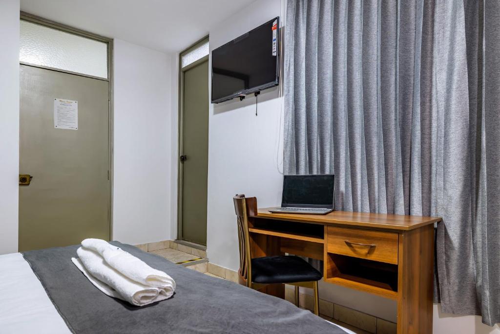 TV a/nebo společenská místnost v ubytování Hotel Taurus