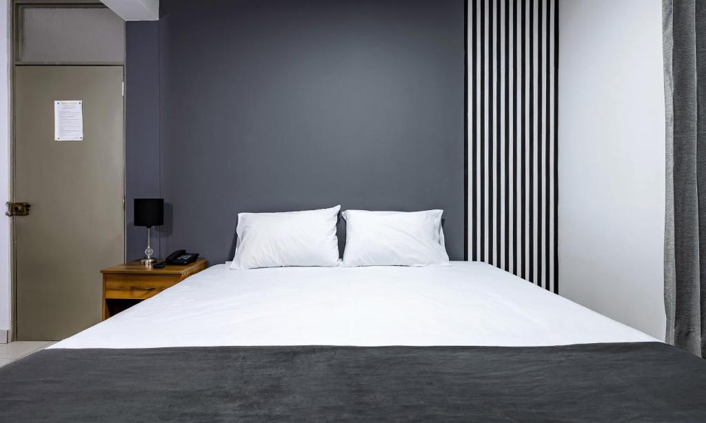 Postel nebo postele na pokoji v ubytování Hotel Taurus