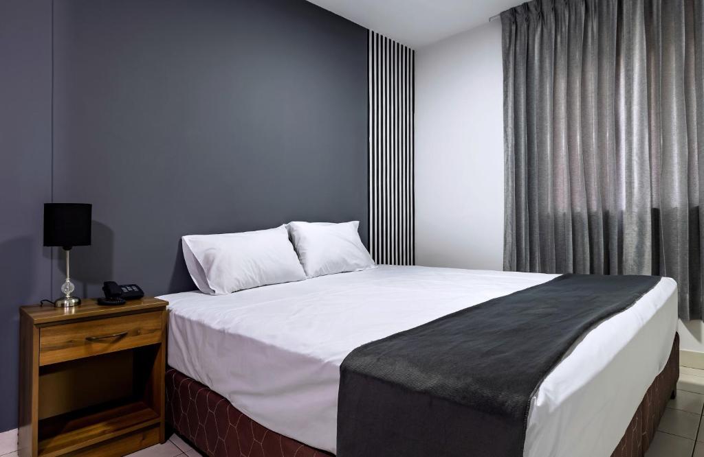 Postel nebo postele na pokoji v ubytování Hotel Taurus