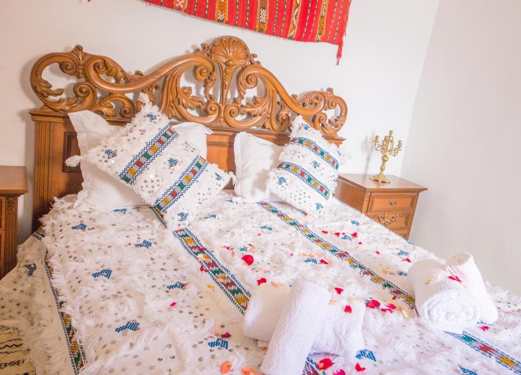 Postel nebo postele na pokoji v ubytování Riad Mahrez