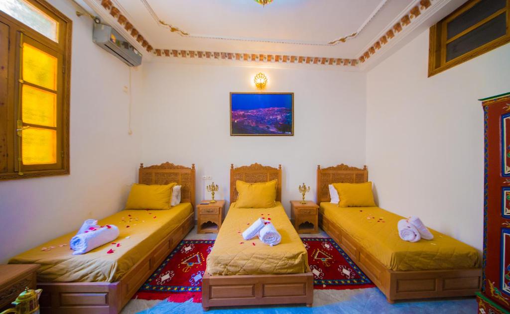 Postel nebo postele na pokoji v ubytování Riad Mahrez
