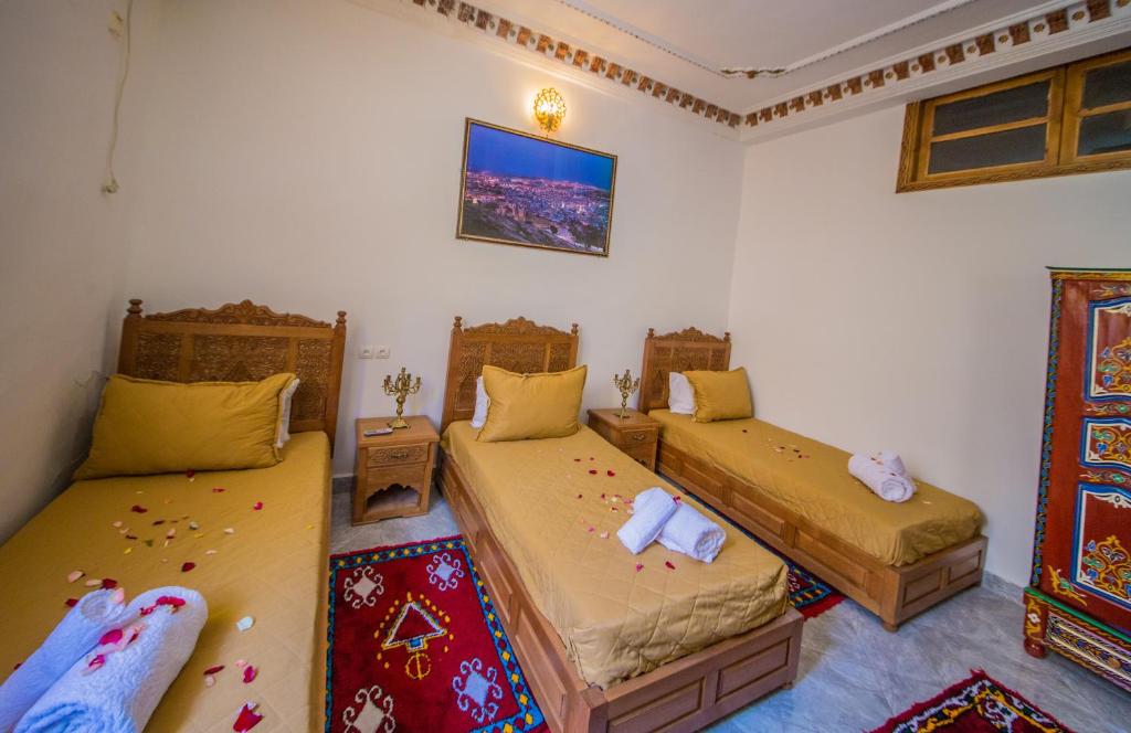 Postel nebo postele na pokoji v ubytování Riad Mahrez