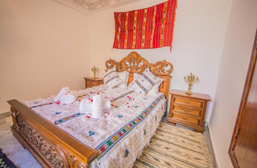 Postel nebo postele na pokoji v ubytování Riad Mahrez