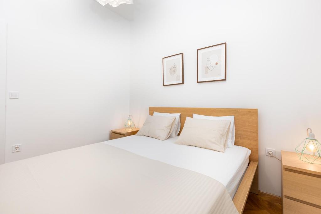 Postel nebo postele na pokoji v ubytování Apartments Cukar