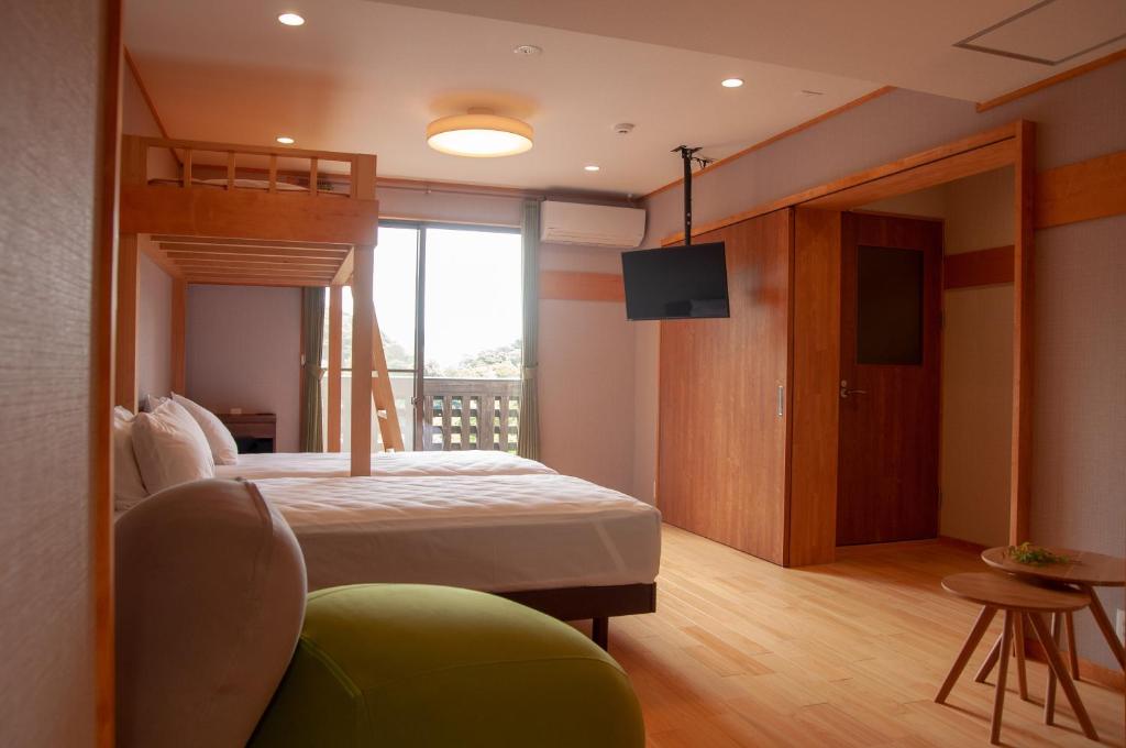 Postel nebo postele na pokoji v ubytování Kirishima miyama hotel