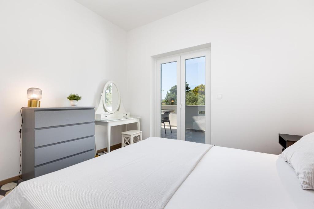 Postel nebo postele na pokoji v ubytování Apartments Cukar