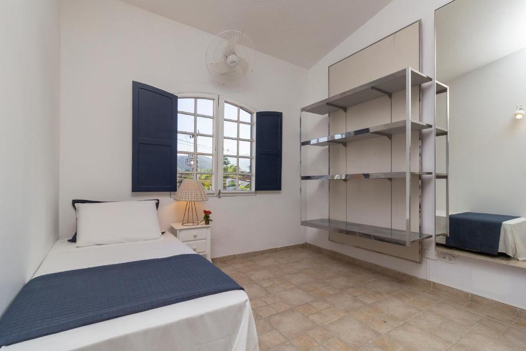 Postel nebo postele na pokoji v ubytování Pousada Casa dos Autores