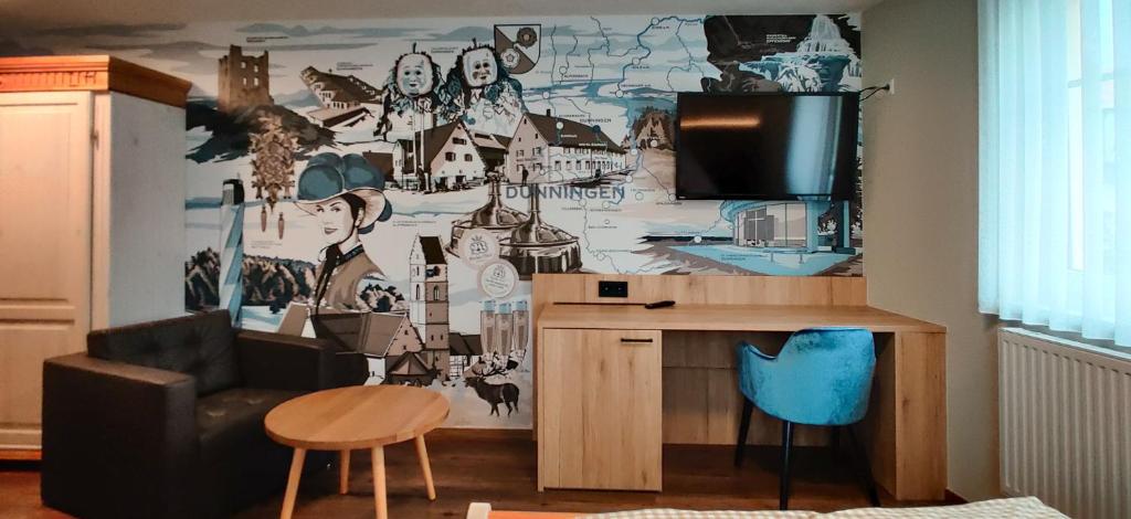 a living room with a wall with a mural at Braustube Wehle in Dunningen