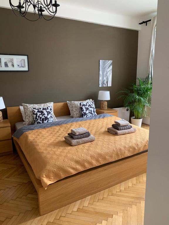 a bedroom with a large bed with two pillows on it at Anenska by Charles Bridge 2 in Prague