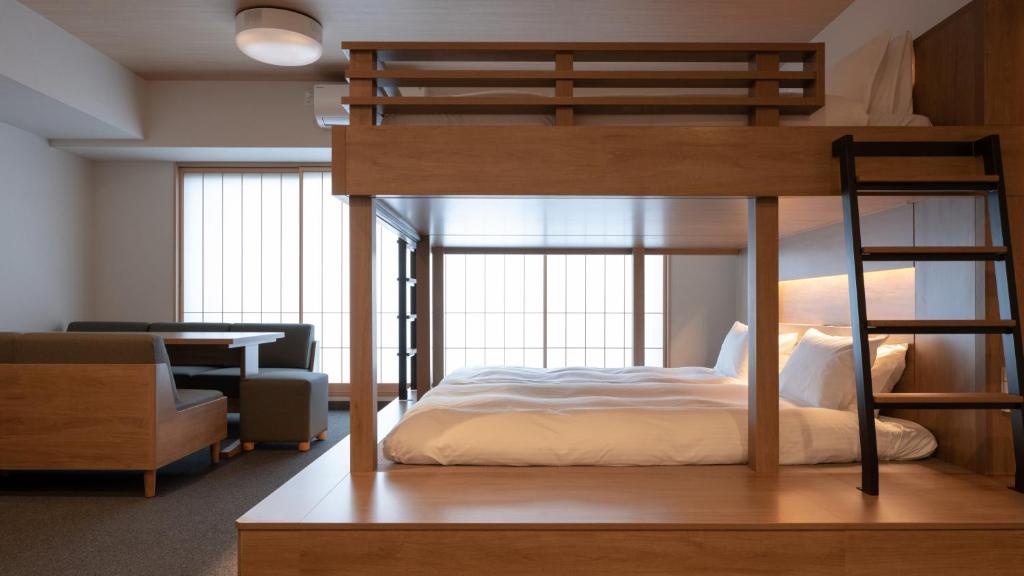 Postel nebo postele na pokoji v ubytování MIMARU Tokyo Kinshicho