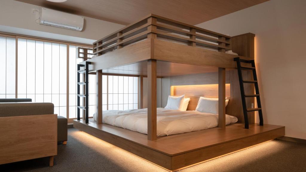 Postel nebo postele na pokoji v ubytování MIMARU Tokyo Kinshicho
