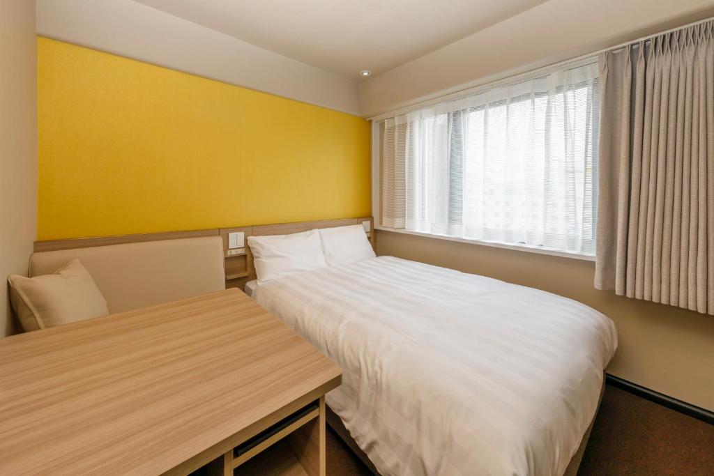 Postel nebo postele na pokoji v ubytování Via Inn Shimonoseki